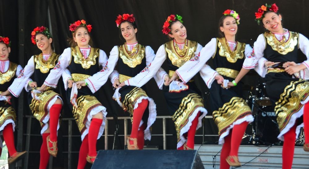 Vibrant Bulgarian folk dancers showcasing cultural heritage through dance.